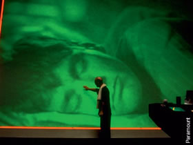 The god-like Christof (Ed Harris) watches over his subject (Jim Carrey) in The Truman Show