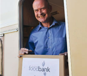 Trevor Feltham collects his box from the Food Bank