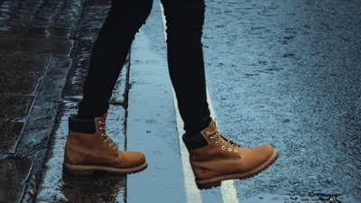 Stepping out image feet crossing road