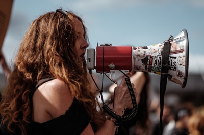 Woman With Microphone Unsplash
