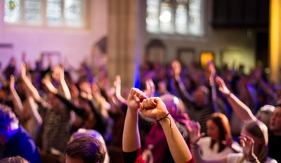 Worshippers raising hands in church idea jan 2023