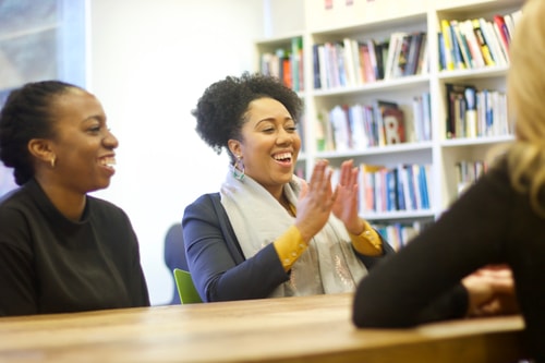 Cassie smiling and laughing