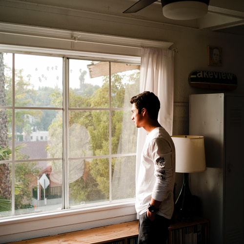 Man standing near window