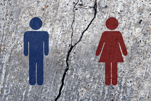 Male and female pictograms on broken asphalt, broken human relationship images stock photo