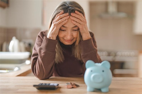 Money worries woman by Iryna Melnyk on istock