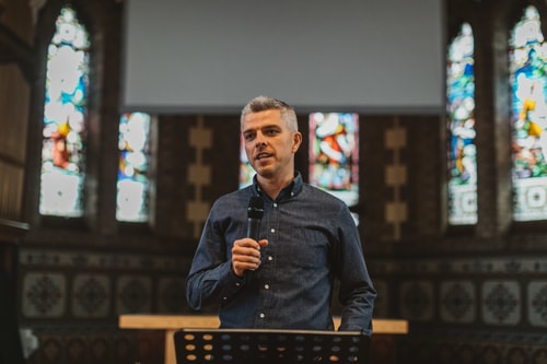 Peter holding microphone