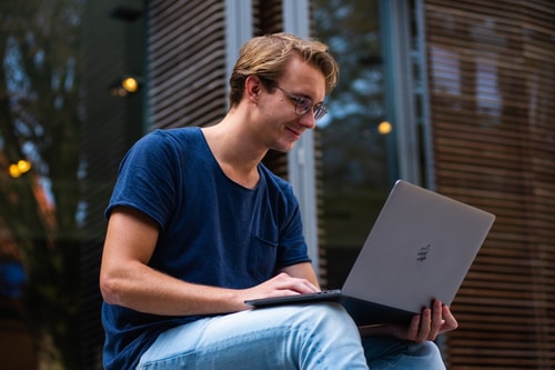Student sitting with laptop