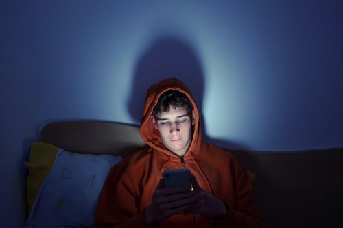 Boy on phone texting