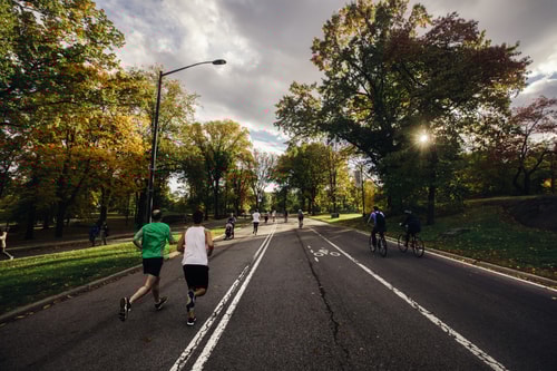 Group running in local park