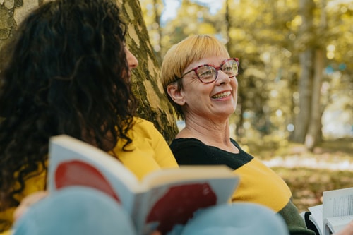 Women talking outdoors autumn