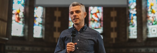 Peter holding microphone