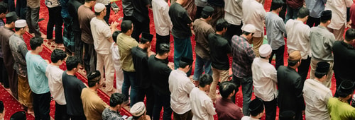 Muslims gathered inside a mosque for prayer, showing unity and devotion in Islamic practice