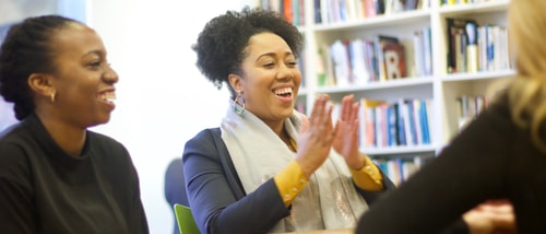 Cassie smiling and laughing