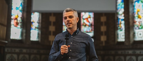 Peter holding microphone